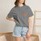 Lumi logo T-shirt | Small orange heart logo tee